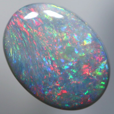 SOLID SEMI BLACK OPAL Sparkles of bright red over green SEE VIDEO